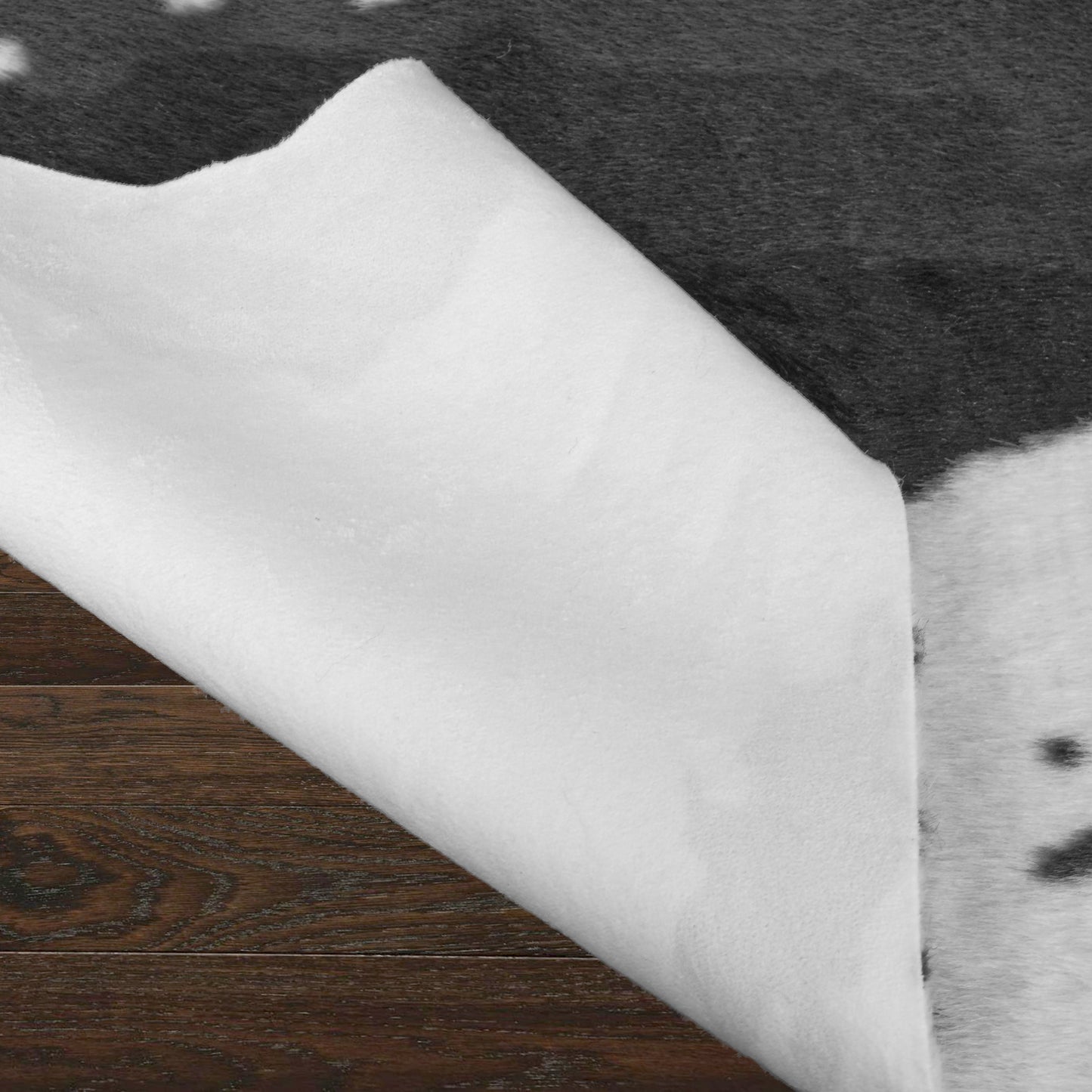 Alecia Faux Cowhide Black and White Area Rug 68 inch by 50 inch