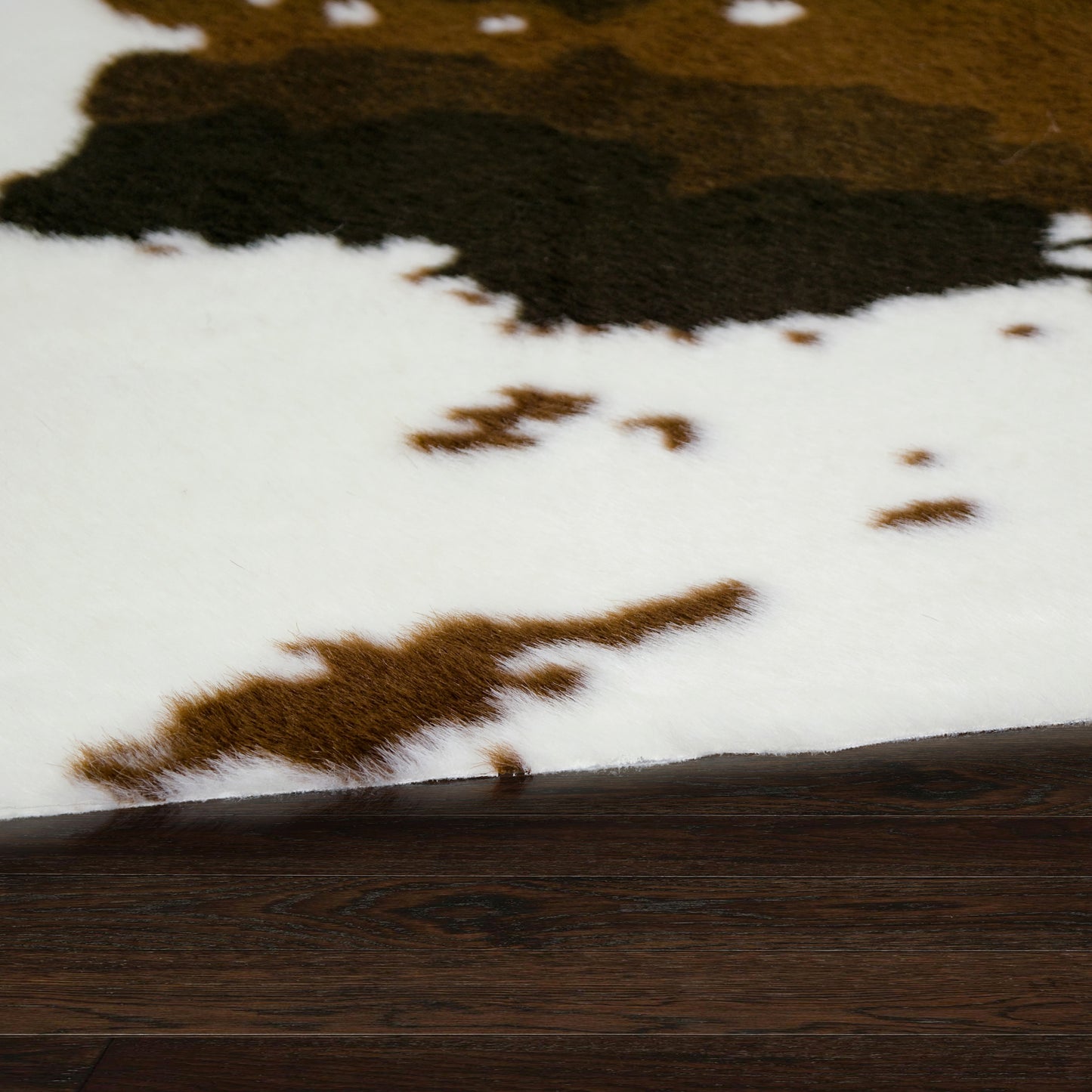 Alecia Faux Cowhide Brown and White Area Rug 68 inch by 50 inch