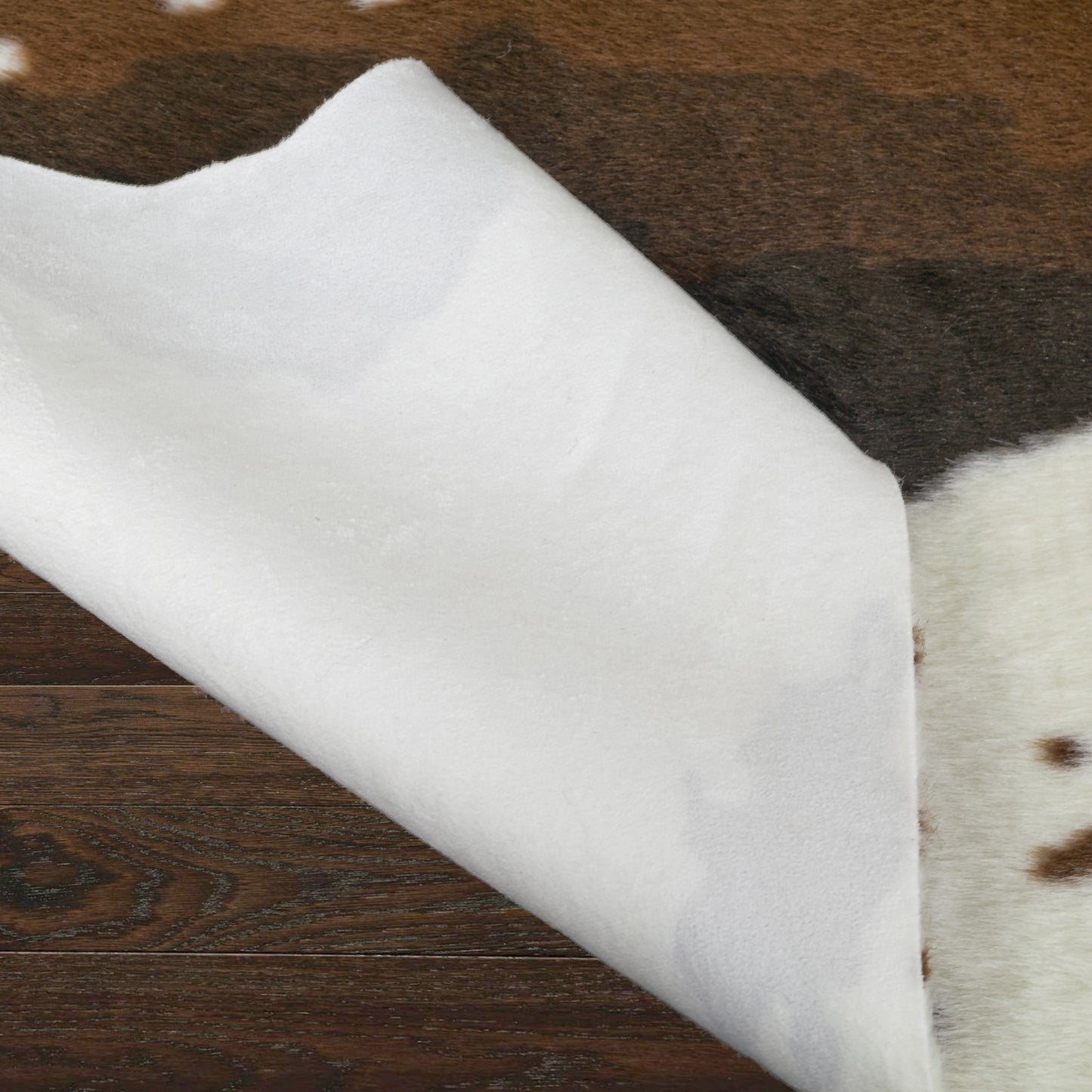 Alecia Faux Cowhide Brown and White Area Rug 68 inch by 50 inch