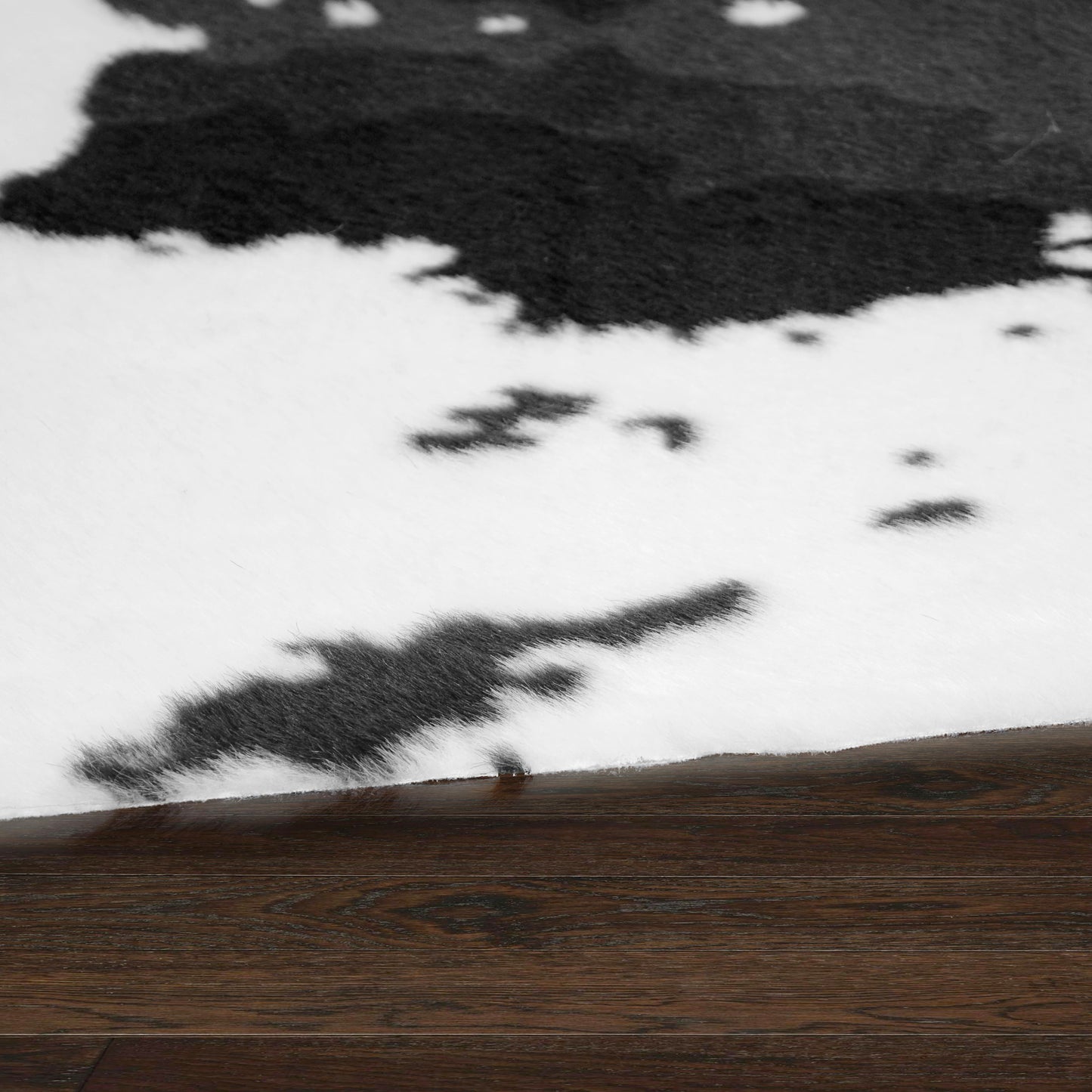 Alecia Faux Cowhide Black and White Area Rug 68 inch by 50 inch